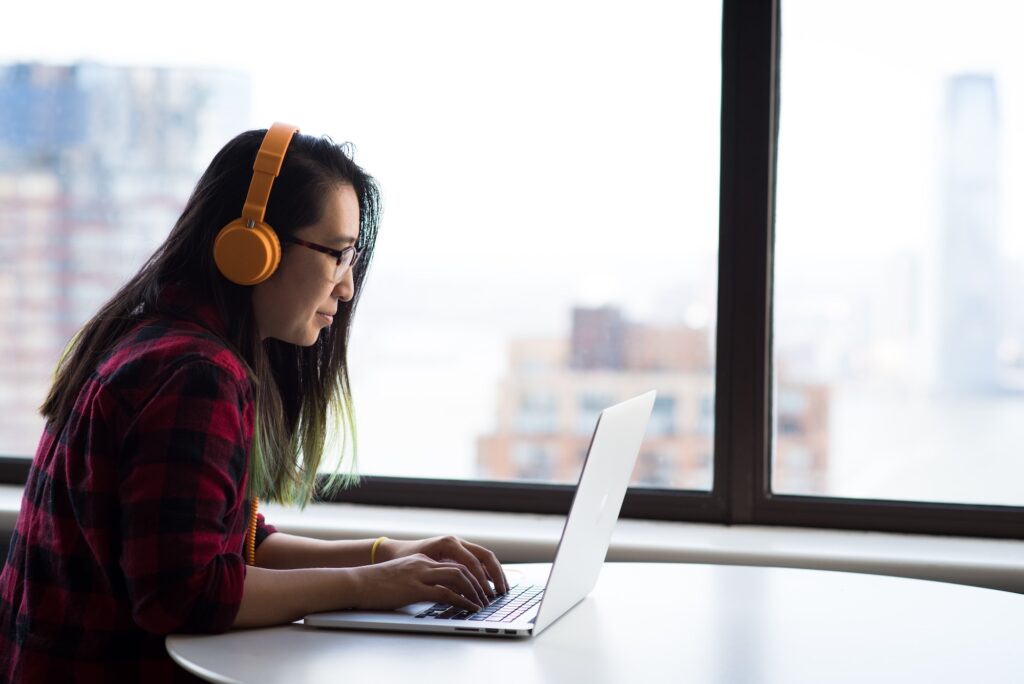 woman at desk working on computer